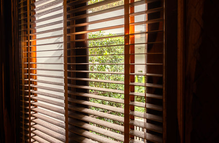 Open wooden window blinds, close up.