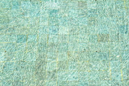 Sunshine through the ripples of water in swimming pool.の写真素材