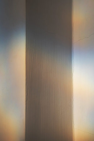 Reflected colorful light patterns on the wall.