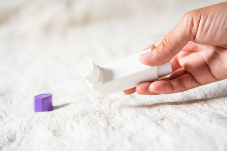 Woman holding asthma inhaler applying for prevent asthma attack.の写真素材