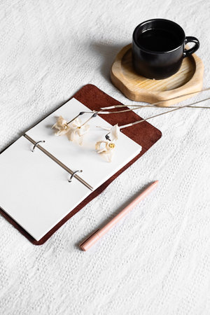 Blank pages of notebook and coffee cup.の写真素材