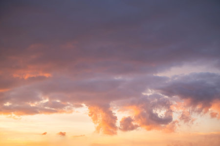 Beautiful sunset sky with vibrant colors and scattered clouds.