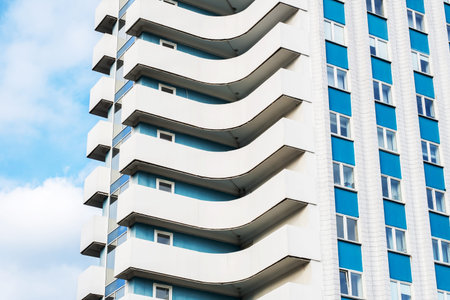 Modern apartment building featuring unique balconies.