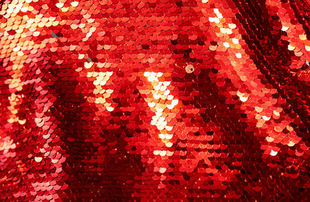 Shiny red sequined textile. Glamorous party or celebration background.の写真素材