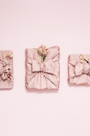 Fabric wrapped gift boxes decorated dried flowers.の写真素材