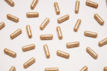 Vitamin capsules on neutral background.の写真素材