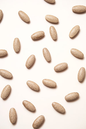 Dietary supplement pills on neutral background.の写真素材