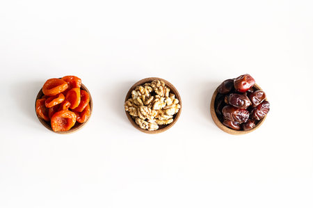 Organic Dates, Walnuts and Apricots a Perfect Trio for Healthy Snacking and Gourmet Recipes.の写真素材