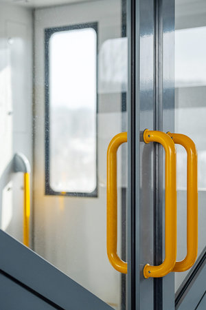 Modern Train Door with Yellow Handles. Passenger Carriage, Safety and Navigation.の写真素材