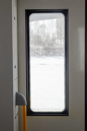 Window view Inside Train, Winter Travel Scene. Seasonal Travel Concept.の写真素材