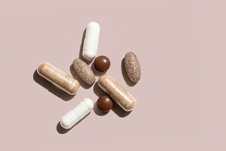 Collection of Various Dietary Supplements Including Capsules and Tablets in Different Colors and Shapes.の写真素材