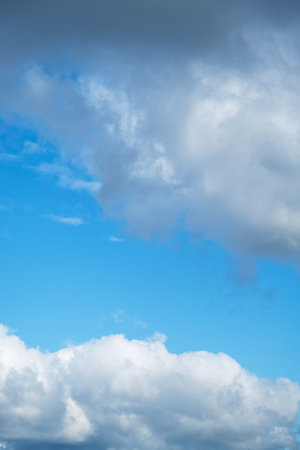 Beautiful Blue Sky Background with White Puffy Clouds. Cloudscape for Nature and Weather Concepts.の写真素材