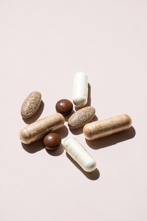 Various Pills Displayed on Muted Background. Healthcare Industry and Pharmaceutical Development.の写真素材