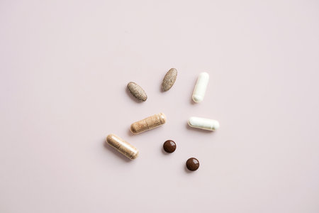Various Pills and Capsules on Light Background. Daily Vitamins and Supplements for Healthy Lifestyle.の写真素材