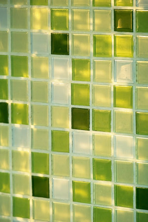 Close Up of Green Mosaic Tile on a Wall. Abstract Background Surface. Modern Square Pattern.の写真素材