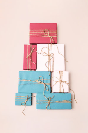 Stack of Colorful Gift Box on Neutral Background. Holiday Presents Setup for Celebration.の写真素材
