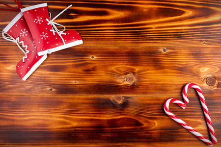 Christmas background with place for text. Striped caramel and toy bootsの写真素材