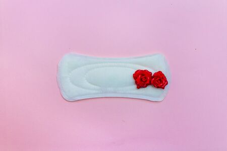 laying on a pink background. Female strip with blood elements. Womens critical daysの写真素材