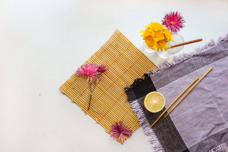 flatlay of a lemon, echinacea on a white surfaceの写真素材