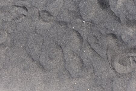Beautiful dark beige glitter sand pattern left after ocean water. Canarian islandの写真素材