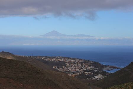 Scenery valley in Spain.Nature landscape.Travel adventures and outdoor lifestyle.Masca valley.Canary island.Scenic mountain landscape.Cactus,vegetation and sunset panorama in Tenerifeの写真素材