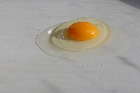 broken egg isolated on a white background. chikenの写真素材