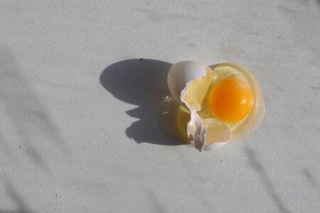 broken egg isolated on a white background. chikenの写真素材