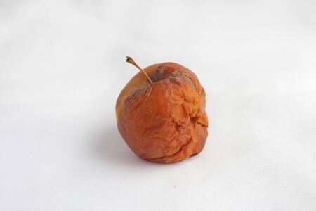 Red rotten apple on white background. conceptの写真素材