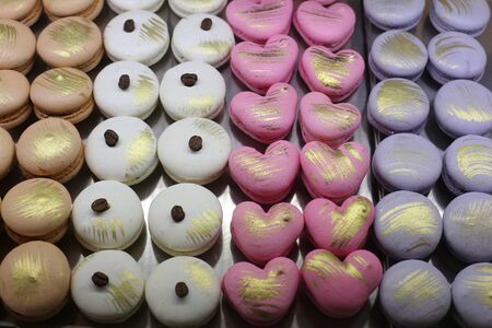 Pastry shop with variety of donuts, muffins, creme brulee, cakes with fruits and berriesの写真素材