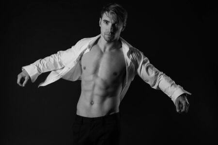 Black and white photo portrait of young man dressed in shirt. sexy manの写真素材