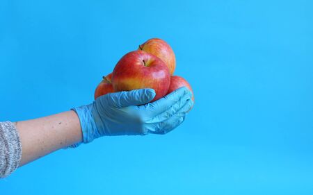 The woman hand holds red apple. Organic foodの写真素材