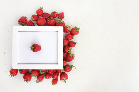 Healthy strawberry isolated on white background frame for text. Copy space. Top view, High...