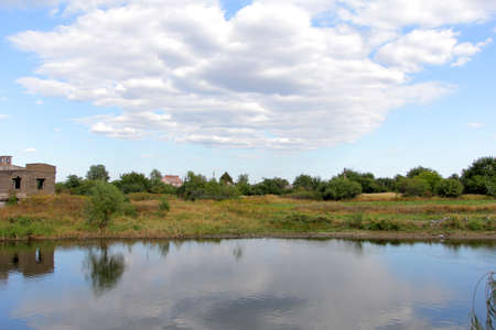 open spaces. Pole. River. Sky. The clouds. Summer Russian landscapes. Road views Summer landscape backgroundの写真素材