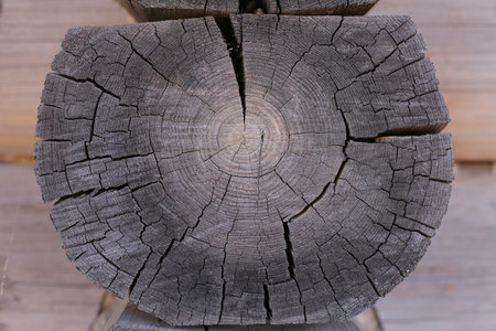 Background of horizontal hewed smooth painted wooden logs close up horizontal view. vintageの写真素材