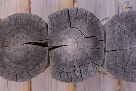 Background of horizontal hewed smooth painted wooden logs close up horizontal view. vintageの写真素材