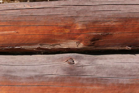 Background of horizontal hewed smooth painted wooden logs close up horizontal view. vintageの写真素材