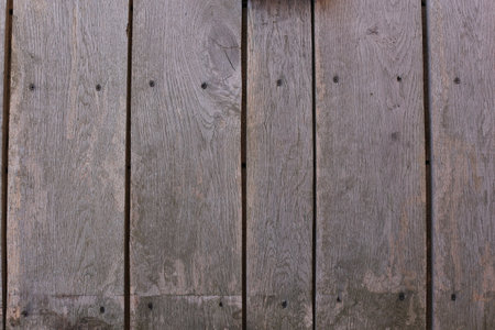 Background of horizontal hewed smooth painted wooden logs close up horizontal view. vintageの写真素材