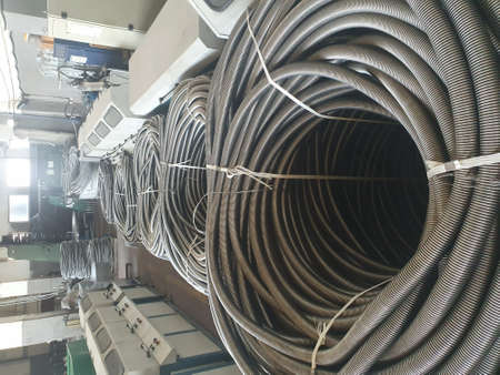 Manufacture of stainless steel braid. Flexible metal pipes with a braid.の写真素材