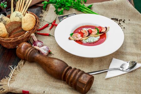 gazpacho with shrimps in a white plateの写真素材