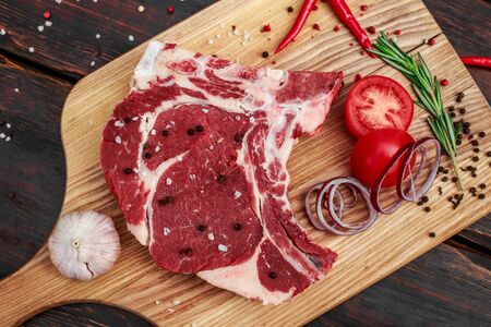 red fresh raw beef veal fillet on cutting plateの写真素材