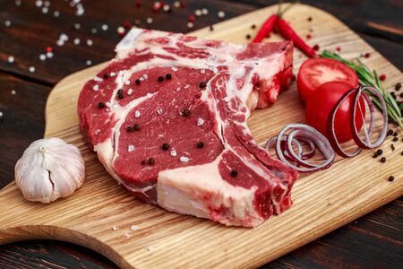 red fresh raw beef veal fillet on cutting plateの写真素材