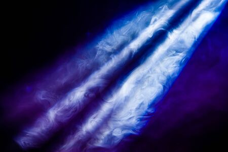 ray of light in the smoke at a concertの写真素材