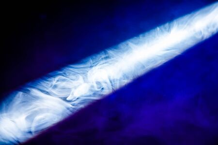 ray of light in the smoke at a concertの写真素材