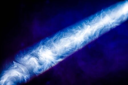 ray of light in the smoke at a concertの写真素材