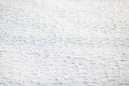 snow surface on a sunny day for a backgroundの写真素材