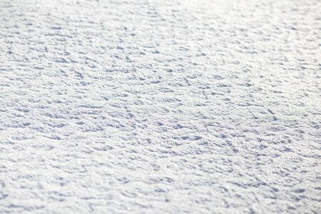 snow surface on a sunny day for a backgroundの写真素材
