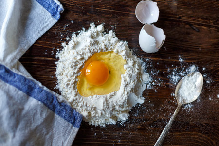 flour and egg on a wooden table