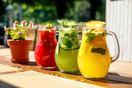 lemonades with lime lemon and raspberries with fruitの写真素材