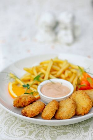 nuggets with French fries and sauceの写真素材