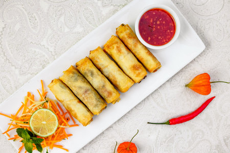 Pancakes stuffed with meat and carrots with spicy sauce